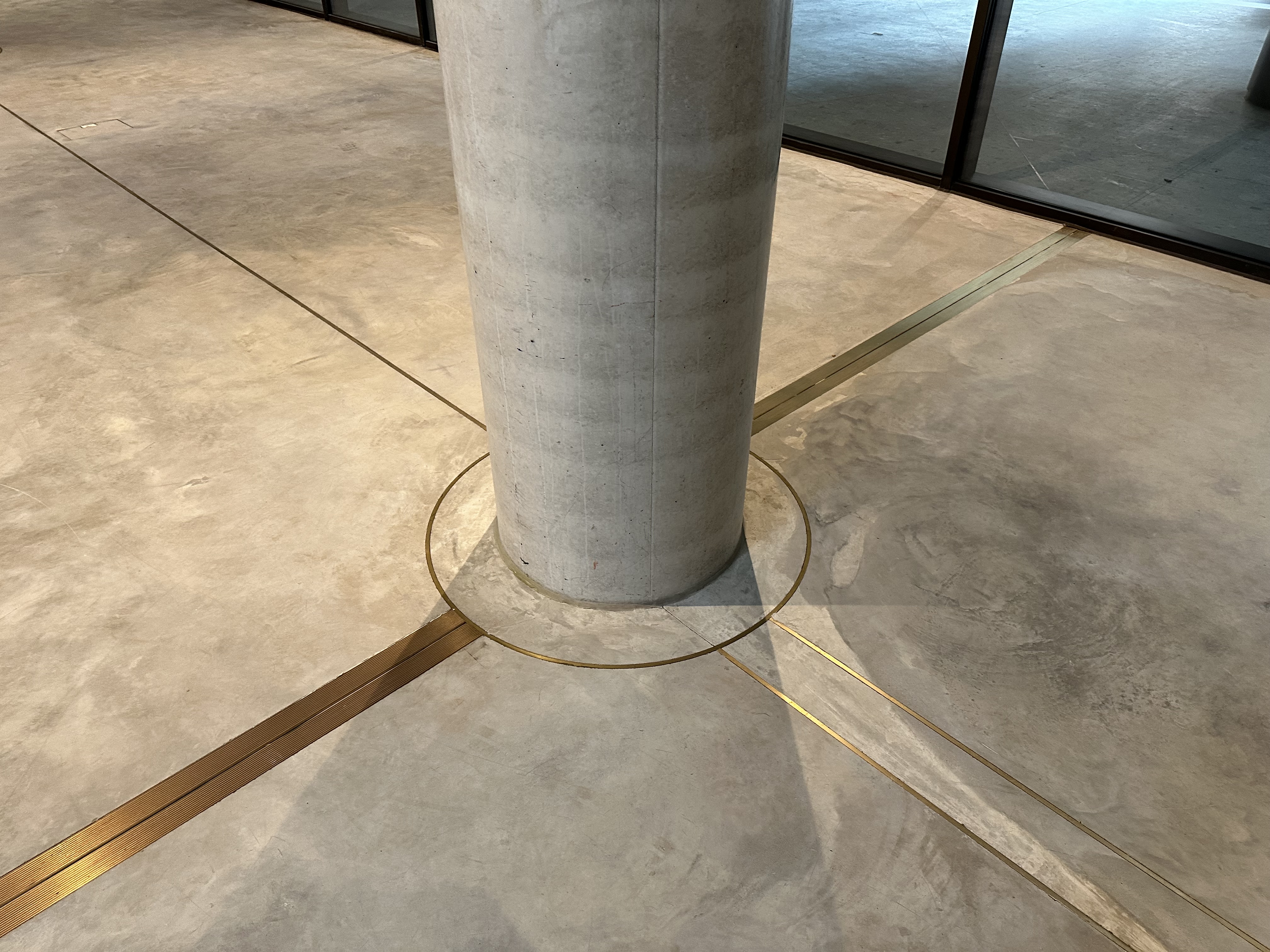 Brass insertions set in slab